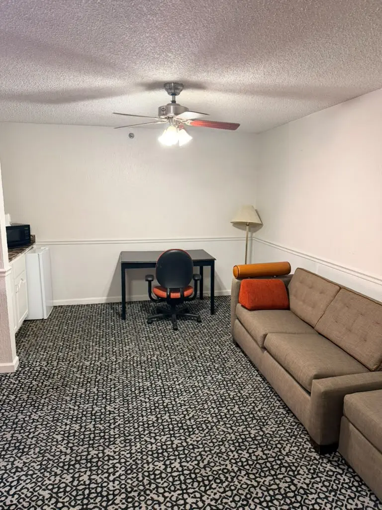 Non-smoking double-bed suite workspace and sofa