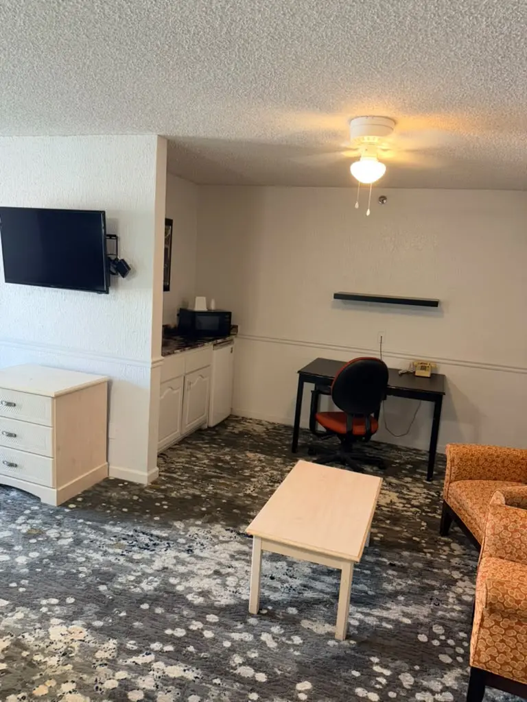 Spacious suite seating area at Garden Cove Hotel Suites