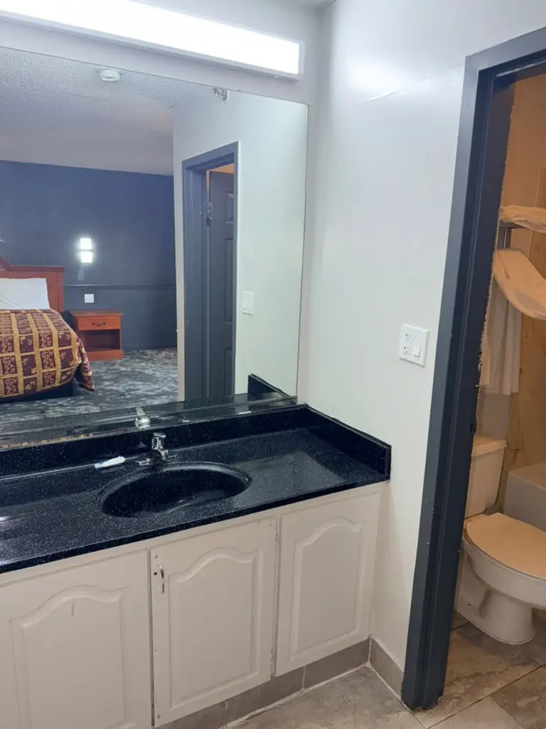 Smoking king suite vanity and bathroom entrance